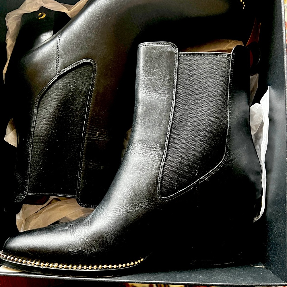 Women’s size 11 Coach fashion boots.